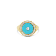 18-karat yellow gold pinky ring with a turquoise centerpiece, encircled by a halo of pave-set diamonds and a central diamond accent. A bold yet elegant design, perfect for adding color and luxury to any outfit.